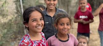 Kids laughing after receiving aid in Gaza